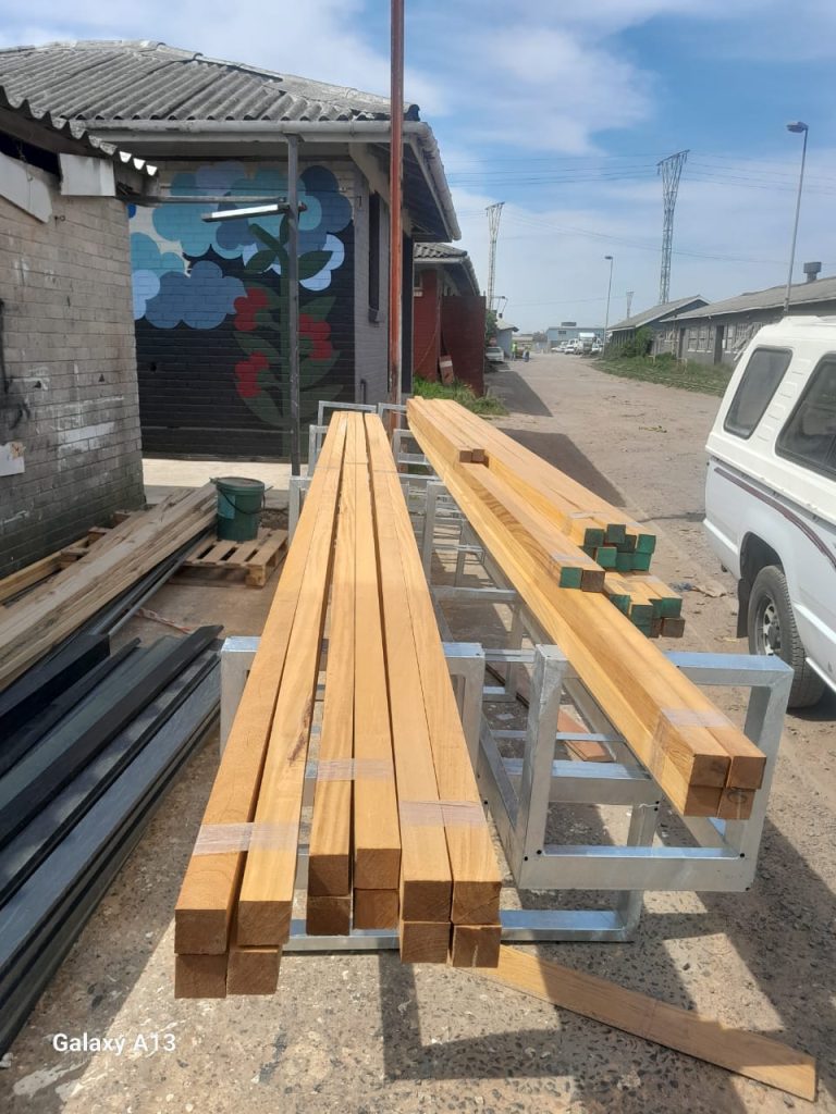 Fabricated aluminium window frames loaded on a bakkie for delivery to a Cape Town site