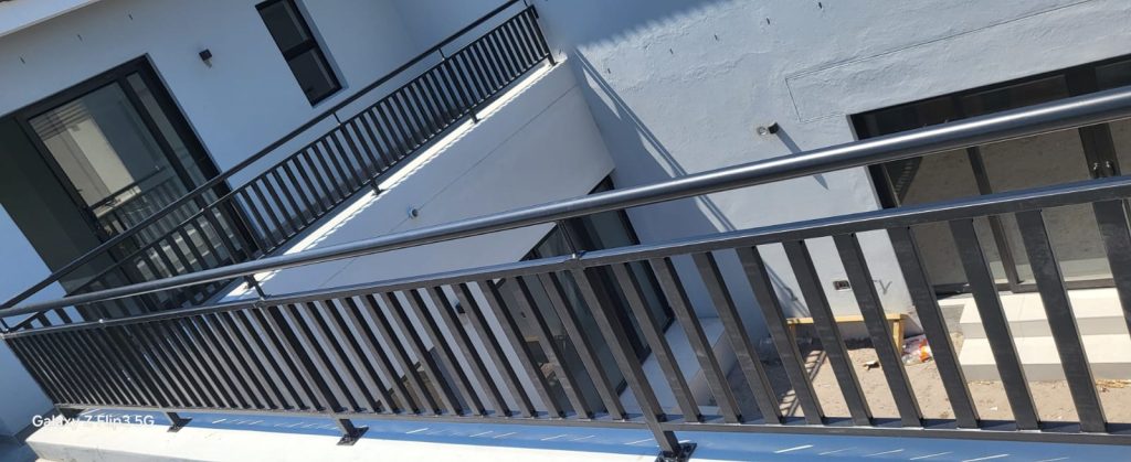 Steel balcony balustrade and staircase railing installed on a modern Cape Town home