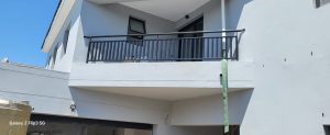 Close-up of a fabricated steel balcony balustrade with vertical slat design, installed by Supar Steel