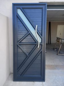 Custom aluminium door with dark sunburst pattern design, Cape Town aluminium doors and windows installation by Supar Steel